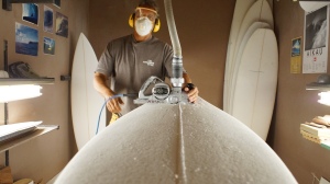 Chuck inside of his shaping room which is located on his property. He's got a good thing going.